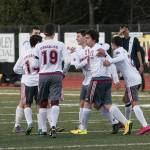 (Brendan Carl | The Daily World) Teammates maul Jose Juarez (21) after he scored what would be the game-winning goal against Seton Catholic during a non-league game at Rottle Field in Montesano on Thursday.