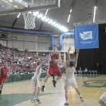 (Brendan Carl | The Daily World) Hoquiam&rsquo;s Jack Adams III drives through the middle of the key to the basket during Wednesday&rsquo;s state 1A boys basketball loser-out opening round contest against Newport at the Yakima SunDome. Newport needed a last-second 3-pointer to defeat Hoquiam, 57-56.