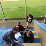 (Submitted photo) Four Aberdeen High School seniors selected a new coat of paint and all of the trimmings for their senior project last summer - repainting the grandstands at Ken Waite Field at Pioneer Park in Aberdeen. The seniors - Kerstain Travis, Jenessa Peterson, Sydni Blood and Kaitlyn Hammonds - spent 34 hours between August 13-15 to complete the project. These avid baseball fans chose this project so the stands would better represent their actual school colors and give them a sense of school pride while watching their school mates play baseball.