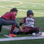 (Brendan Carl | The Daily World) Montesano&rsquo;s Lexi Lovell slides into third, just under the tag of Hoquiam&rsquo;s Jade Cox.