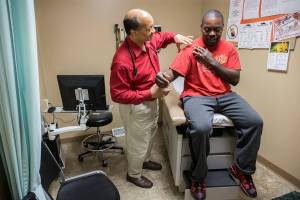 Zbigniew Bzdak/Chicago Tribune                                 Dr. James Jackson, MD, examines Matthew Shorter, 51, a medicaid patient enrolled in the Healthy Indiana Plan (HIP), at the Heart City Health Cente in Elkhart, Ind.