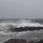 Waves, whipped by high winds, crash over the rocks at Westport on Friday afternoon.                                (Travis Rains | GH Newspaper Group)