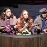 Above: Grotto Good (Casey Bronson, left) and and Gretta Good (Julayne Fleury, right) tell Iris (Chaela Watkins) about her new life in their castle. Below: From left, Iris (Chaela Watkins), Hazel (Emma Dorsch) and Elmer (Amelia Moore) play in the rain.