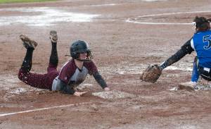 Bulldogs swing in the rain to beat Elma