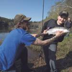 After a quick battle for his catch, Bryson Brown holds up a trout that he entered into the Grays Harbor Poggie Club kids-only fishing derby held at Failor Lake in 2015. (Daily World File Photo)