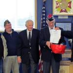 Photo by Scott D. Johnston: On hand for the mortgage burning were newly installed Post officers (L-R) Otis Warren, Robert Hakanson, Bob Howe, Jim Docherty, John Link, Dan Martin and Robin Johnson.
