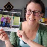 North River teacher Heather Johnson shows a photo of her first second-grade class in 2013-14. All four of them played major roles in this year&rsquo;s production of &ldquo;Annie.&rdquo; (Photo by Kat Bryant | The Daily World)