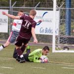 (Brendan Carl | The Daily World) Hoquiam goalkeeper Johnny Smith smothers a ball before Montesano&rsquo;s Connor Parkinson can make a shot on goal on Thursday.