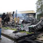 DAN HAMMOCK THE DAILY WORLD                                Owner Terry Kost surveys the damage to the cedar furniture operation after it burned down early Wednesday morning. He&rsquo;d owned the property on the Fifth Street Extension in Hoquiam since 2002.