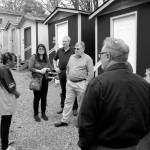 DAN HAMMOCK THE DAILY WORLD                                Sharon Lee, Director of the Low Income Housing Institute, introduced a group from Grays Harbor to residents of a tiny house village in Seattle. Facing the camera from left are Lee, Tim Quigg and Grays Harbor County Commissioner Randy Ross.