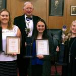 Courtesy photo                                Scholarship winners (from left) Jordan Spradlin, Grace Aiken and Kylie Boling stand with Buckley Strong, school awards chairman for Wynooche Masonic Lodge 43.