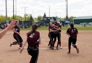 (Brendan Carl | The Daily World) Ocosta players celebrate defeating Adna 6-2 to earn the school&rsquo;s first ever state tournament berth on Saturday.