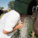 (Brendan Carl | The Daily World) Montesano players give head coach Pat Pace a water bath after the Bulldogs won the state title on Saturday.