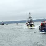 Photo by Kat Bryant | The Daily World                                 The line formed behind the Coast Guard vessel for the Parade of Boats.