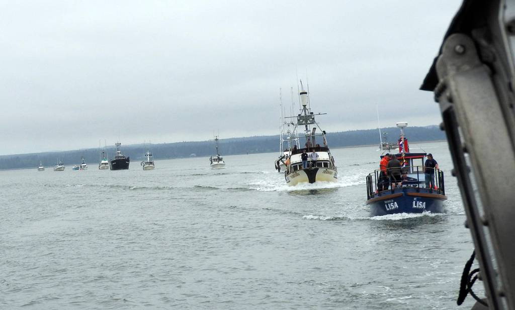 Photo by Kat Bryant | The Daily World                                 The line formed behind the Coast Guard vessel for the Parade of Boats.