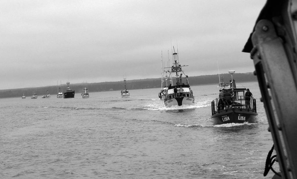 Photo by Kat Bryant | The Daily World                                 The line formed behind the Coast Guard vessel for the Parade of Boats.