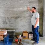 Kat Bryant | The Daily World                                Rob Paylor, a partner in Hoquiam Brewing Co., shows off the concrete walls he sanded himself. &ldquo;I probably couldn&rsquo;t have paid somebody to do as much work as we did to these walls,&rdquo; he says.