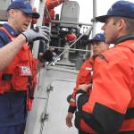 CWO Cheston Evans gives instructions to Nicholas Samano and Joe Dickson before getting underway.