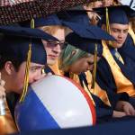 Eric Haven blows up a beach ball during Aberdeen High&rsquo;s graduation ceremony on Friday night. (Photo by Matthew Coyle)