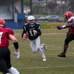 (Brendan Carl | The Daily World) Grays Harbor&rsquo;s Justin Spencer sprints away from a defender after making a catch on Saturday.