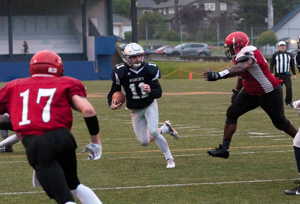 (Brendan Carl | The Daily World) Grays Harbor&rsquo;s Justin Spencer sprints away from a defender after making a catch on Saturday.