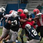 (Brendan Carl | The Daily World) Grays Harbor Bearcat defenders smother an Outlaw runner during their game on Saturday. The Bearcats defeated the Outlaws 38-12.