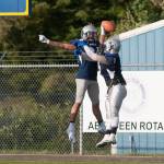 (Brendan Carl | The Daily World) Kareem Johnson, left, and Deeshawn Benjamin celebrate after Johnson picked off a pass for a touchdown on Saturday.