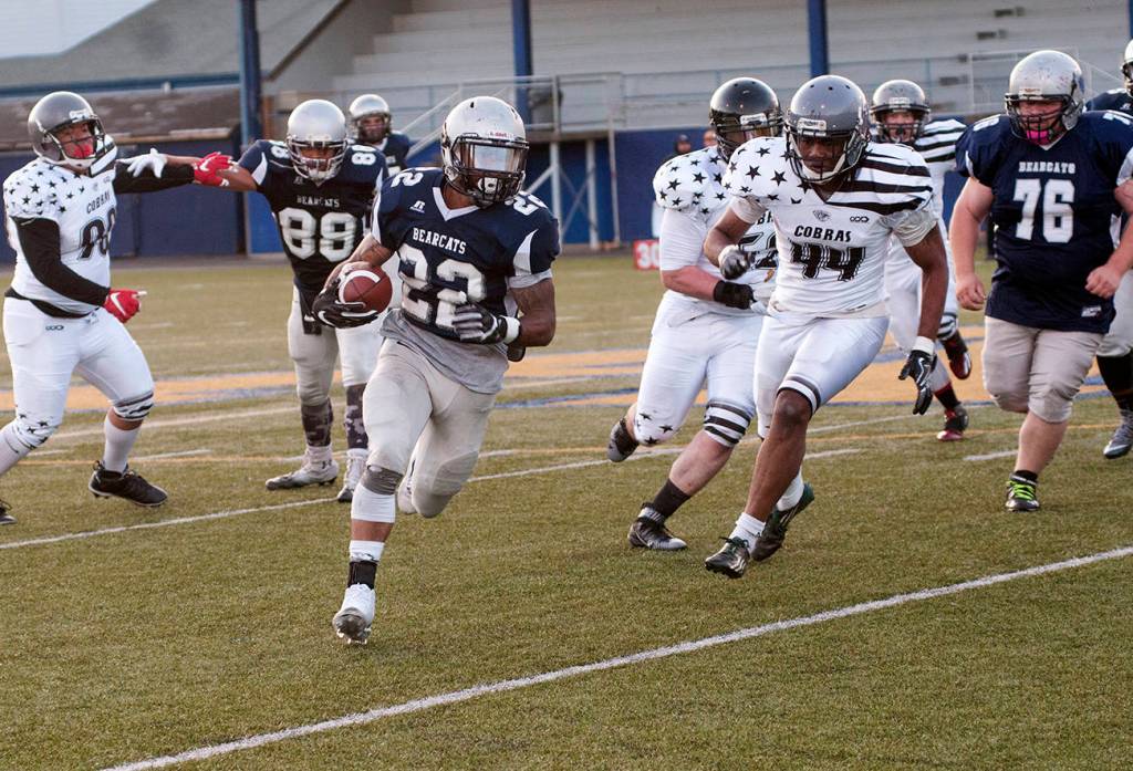 (Brendan Carl | The Daily World) Grays Harbor Bearcats&rsquo; Jordan Harrington runs the ball against the Cowlitz Cobras on Saturday.