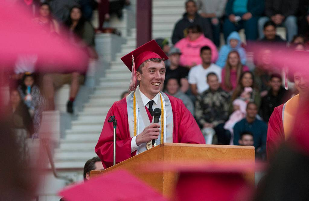 (Brendan Carl | The Daily World) Hoquiam valedictorian Christopher Smith speaks to his fellow classmates at Olympic Stadium on Friday night.