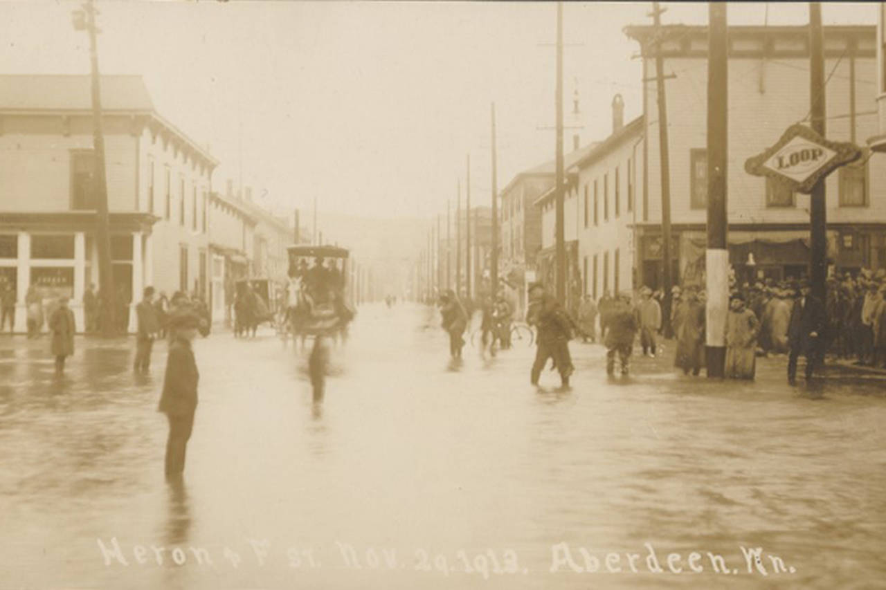 Looking north up F Street at east Heron Street on Nov. 29, 1913, when Aberdeen experienced a particularly nasty bout of flooding. The sign for the Loop Saloon is visible on the right. Today that location is the home of the Breakwater Seafood restaurant. (Aberdeen Museum Collection)