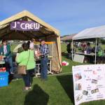 The &ldquo;J&rdquo; Crew, one of the Relay&rsquo;s many fundraising teams, sets up its concession stand on the infield during Relay for Life on Friday afternoon. (Photo by Scott D. Johnston)