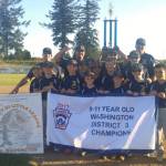(Rob Burns | The Daily World) Aberdeen Little League&rsquo;s 9-11 All-Star team holds up the District III 9-11 championship pennant and the championship trophy after defeating Montesano, 11-2, in the district championship game on Thursday at 10th Street Park in Elma.