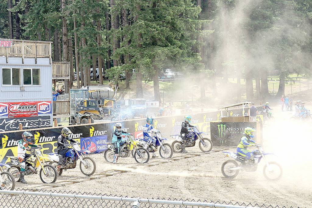 (Travis Rains | The Vidette) Motocross racers jump from their start July 16 at the Grays Harbor ORV Park.