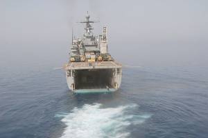 An amphibious assault vehicle departs the well deck aboard the Navy dock landing ship USS Rushmore during an exercise. This ship will deploy another vessel with equipment and vehicles as part of the emergency preparedness exercise coming to the Westport boat launch Aug. 1. (U.S. Navy photo by Mass Communication Specialist 1st Class Elizabeth Merriam)