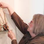 Kat Bryant | The Daily World                                 Nancy Eichenberger arranges some of her jewelry for display at Six Rivers Gallery.
