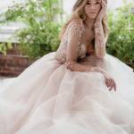 Photo courtesy Seattle Bride                                 Heather Dublanko models a $4,290 Hayley Paige gown in one of her many photos in the current edition of Seattle Bride magazine.