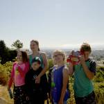 (Doug Barker | The Daily World) From left, Ella Horton, Amanda Dee, Alex Dee (black sweatshirt), Myleigh Gramson and Kain Horton, pose for posterity as the eclipse was waning Monday morning at Community Hospital. Barely visible behind Myleigh is Ary Jenkins.