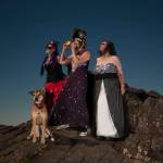 (Photo by Bob Merrill)                                From left: Erin Young, Marcy Merrill and Kat Bryant (with Rose, of course) enjoy the eclipse in style atop Radar Ridge, near Naselle.