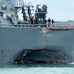 Joshua Fulton/Planet Pix/Zuma Press                                 The USN Arleigh Burke-class guided-missile destroyer USS John S. McCain, with damage to the port side of the hull, docked Monday at Changi Naval Base in Singapore for emergency repairs.