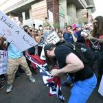 Wally Skalij photos | Los Angeles Times                                 ABOVE: Protesters rip a Confederate flag outside the Phoenix Convention Center as President Donald Trump spoke inside on Tuesday. RIGHT: Police fire tear gas at protesters.