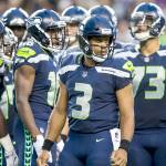 Seattle Seahawks quarterback Russell Wilson (3) huddles with the offense as Seattle takes on the Minnesota Vikings on Friday, Aug. 18, 2017, at CenturyLink Field in Seattle. (Bettina Hansen/Seattle Times)