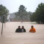 Rising flood waters stranded hundreds of residents of Twin Oaks Village in Clodine, Texas, where a collection of small boat owners, including some with pool toys, coordinated to bring most to dry ground. (Robert Gauthier/Los Angeles Times)