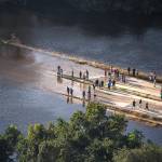 People come out to visit the flooded areas near their homes in Houston. (Marcus Yam | Los Angeles Times)