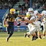 Aberdeen running back Kylan Touch straight arms a would-be Montesano tackler Friday night. Touch ran for 124 yards, caught four passes for 81 yards and a touchdown and even threw a 70-yard scoring strike to Cameron Hochstetler. (Brendan Carl | For The Daily World)
