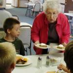 (Scott D. Johnston | For The Daily World)                                Volunteer Connie Jones serves dessert during a recent free community meal at Galilean Lutheran Church in Ocean Shores.