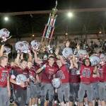 The Hoquiam Grizzlies celebrate their 14-12 victory over rival Aberdeen in the 112th meeting of the two teams on Friday night at Olympic Stadium. (Brendan Carl Photography)