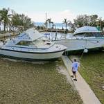 Chris Morgan inspects the large boats that beached onto the property she in stayed during Hurricane Irma&rsquo;s storm surge in Key Largo, Fla., on Tuesday. (Al Diaz/Miami Herald)