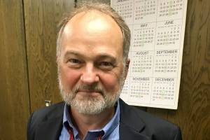 DAN HAMMOCK | THE DAILY WORLD                                Aberdeen City Attorney Eric Nelson officially retired at the end of the City Council meeting Wednesday evening. To celebrate, with gentle nudging from Mayor Erik Larson, he pulled at the ends of his bright red bowtie and opened his collar.