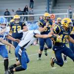 (Travis Rains | Grays Harbor Newspaper Group) Kylan Touch avoids and breaks tackles as he makes his way to the end zone for the first touchdown of Friday night&rsquo;s game.