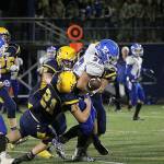 (Travis Rains | Grays Harbor Newspaper Group) Elma&rsquo;s Taitum Brumfield manages to hang onto the ball while Aberdeen goes for the strip.